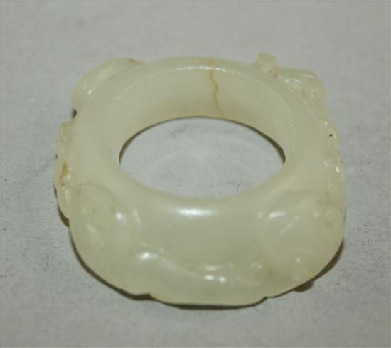 A Chinese white jade archers thumb ring, 18th / 19th century, 3cm